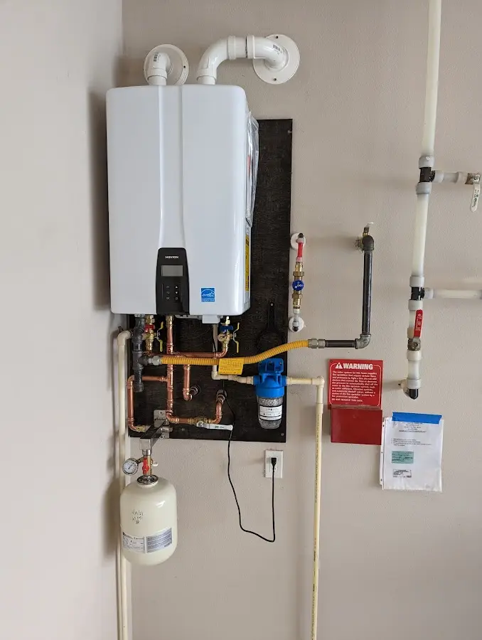 Professional plumber installing copper piping in a Rayville home